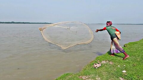 Traditional man catching fish from river/Real life river fishing