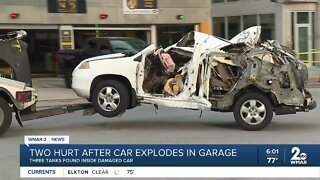 Two hurt after car explodes in downtown parking garage