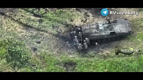 Ukrainian soldiers evacuate their wounded under artillery fire at Vremevsky ledge