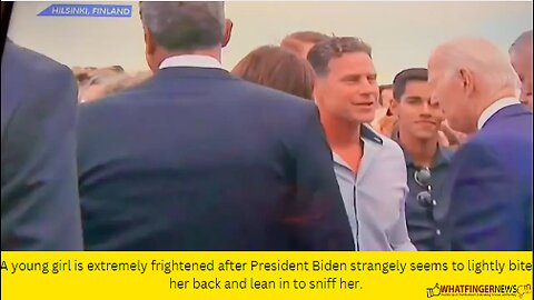 A young girl is extremely frightened after President Biden strangely seems to lightly bite her back