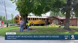 Driver hurt after school bus with 32 students on board crashes into house