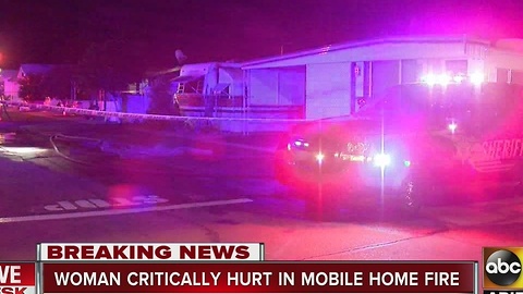 Woman in critical condition after being pulled from a mobile home fire