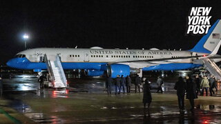 A female White House staffer falls, slides down the steps of Air Force One in Poland