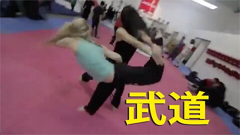 Brave Female Martial Arts Instructor Demonstrating Her Technics