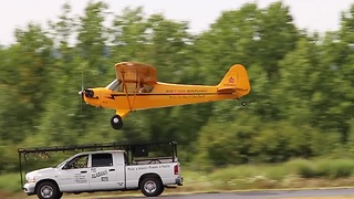 Pilot lands airplane on top of a moving truck