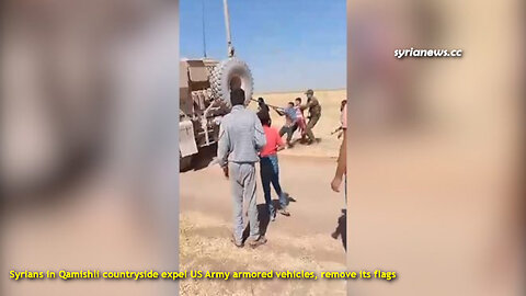 Syrians in Qamishli countryside expel US Army armored vehicles remove its flags