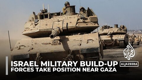 Israeli troops and tanks continue to mass near border with Gaza