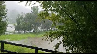 Downpour has creek overflowing and flooded paddock. Australian extremes