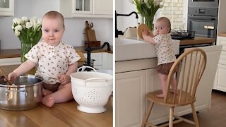 Hardworking baby helps mommy with all the housework