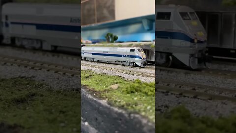 N scale Amtrak train leaving the station