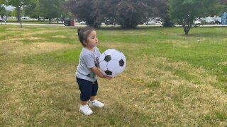 Cutest kid enjoying playing football