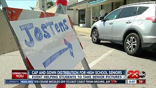 Cap and gown distribution for high school seniors