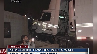 Semi truck plows through neighborhood entrance