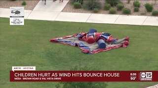 Four children hospitalized after bounce house is picked up by wind in Mesa