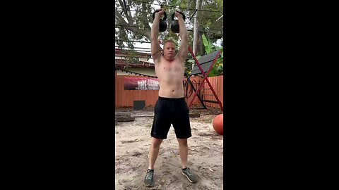 5. Kettlebell Press 50lbs/ 22.7kg per hand