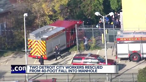 Two workers rescued after falling down manhole in Detroit