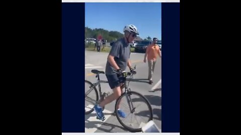 President Biden falls off the bike