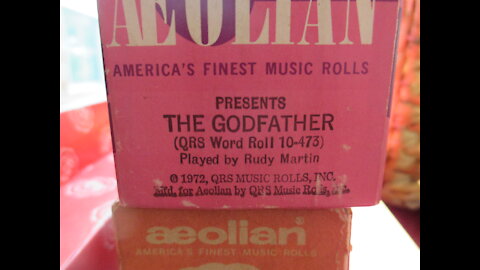 The Godfather movie song "Speak Softly, my love" played on a pianola