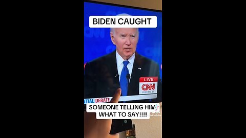 Someone telling Joe Biden what to say during Presidential Debate