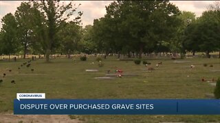 Religious organization paid for graves but says the cemetery is blocking use