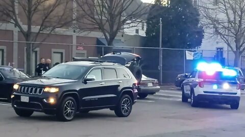 Boston police towing a car with paper plates