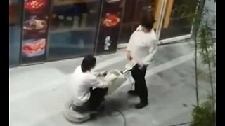 Lazy worker hitches ride on floor polisher