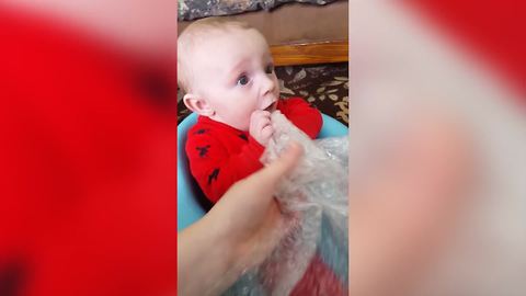 "Baby Tries To Taste The Bubble Wrap"