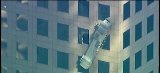 Two workers almost fall off building in Manhattan