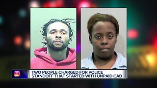 Two people charged for police standoff that started with unpaid cab