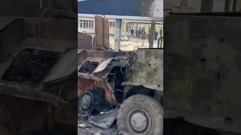 Destroyed BTR-80 and a military truck of the armed forces of Ukraine