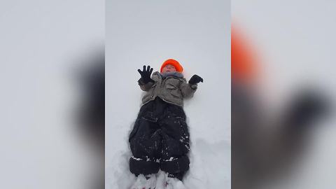 Little Boy Fails At Making A Snow Angel