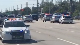 Section of Okeechobee Blvd. shut after a report of a man with a weapon