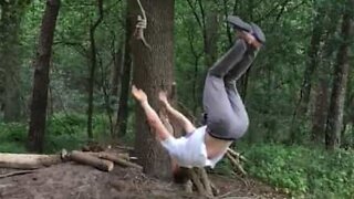 Stuntman pulls backflip and avoids swing rope fail