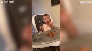 Baby's reaction to pizza is so adorable