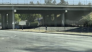 Golf next to a highway.