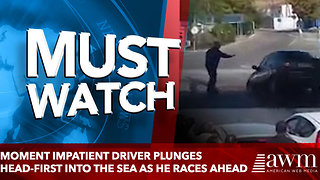 Moment impatient driver PLUNGES head-first into the sea as he races ahead