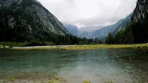 Rain in shallow water at a beautiful mountain view