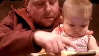 Adorable Baby Playing With Her Dad’s Smartphone