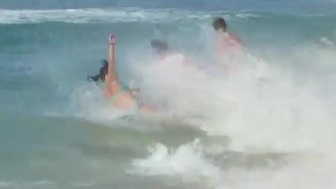 "Collecting Seashells FAIL: Family Gets Knocked Down by Wave"