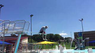 Senior Man Dives Into A Swimming Pool