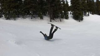 Snowboarder breaks his helmet in spectacular fall