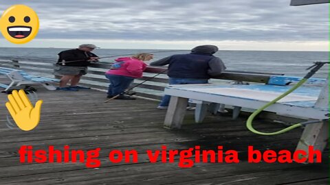 Fishing on Virginia Beach boardwalk And guy catches bluefish