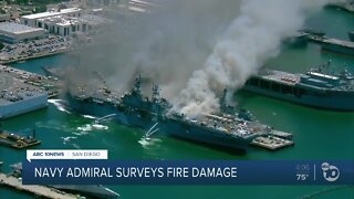 Navy Admiral surveys fire damage