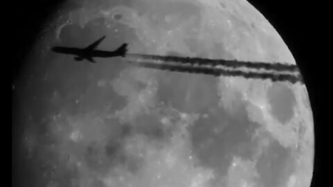 Aeroplane crossing the moon