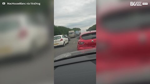 Ice cream van does brisk business while stuck in traffic
