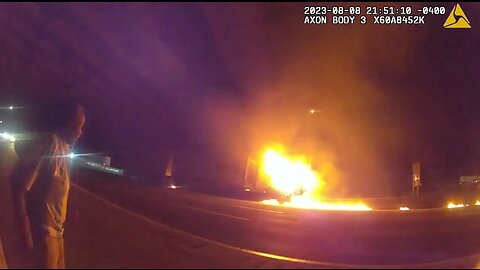 Body cam shows police pulling unconscious man from burning truck on interstate