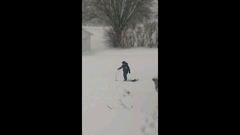 Snow sledding During Snow Storm