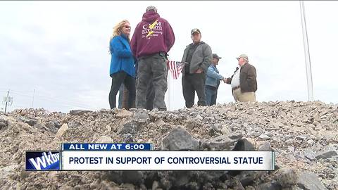 Group protesting in support of statue for Grand Island WWII hero