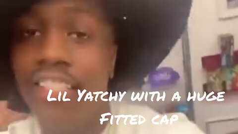 Lil Yatchy with an oversized fitted cap