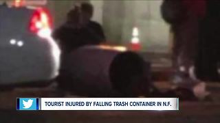 Tourist hurt by falling garbage can from parking ramp